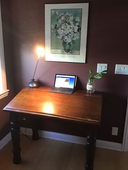 Solid wood desk with storage area.