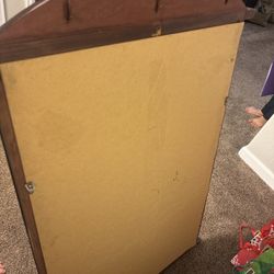 Wooden framed mirror with gold assets