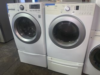LG front load washer & electric dryer with pedestals working perfectly with 4 months warranty