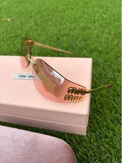 Pink Rimless Miu Miu Women’s Sunglasses