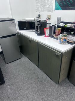 Cabinet with drawers and trash bin