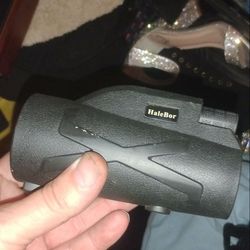 HaleBor monocular telescope. This model, which appears to be a 100x90is a portable, high-powered optical device typically used for outdoor activities.