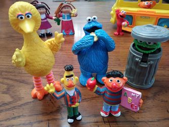 Vintage Sesame Street toys, plastic bus, Kermit the frog, and 2 cabbage patch figures