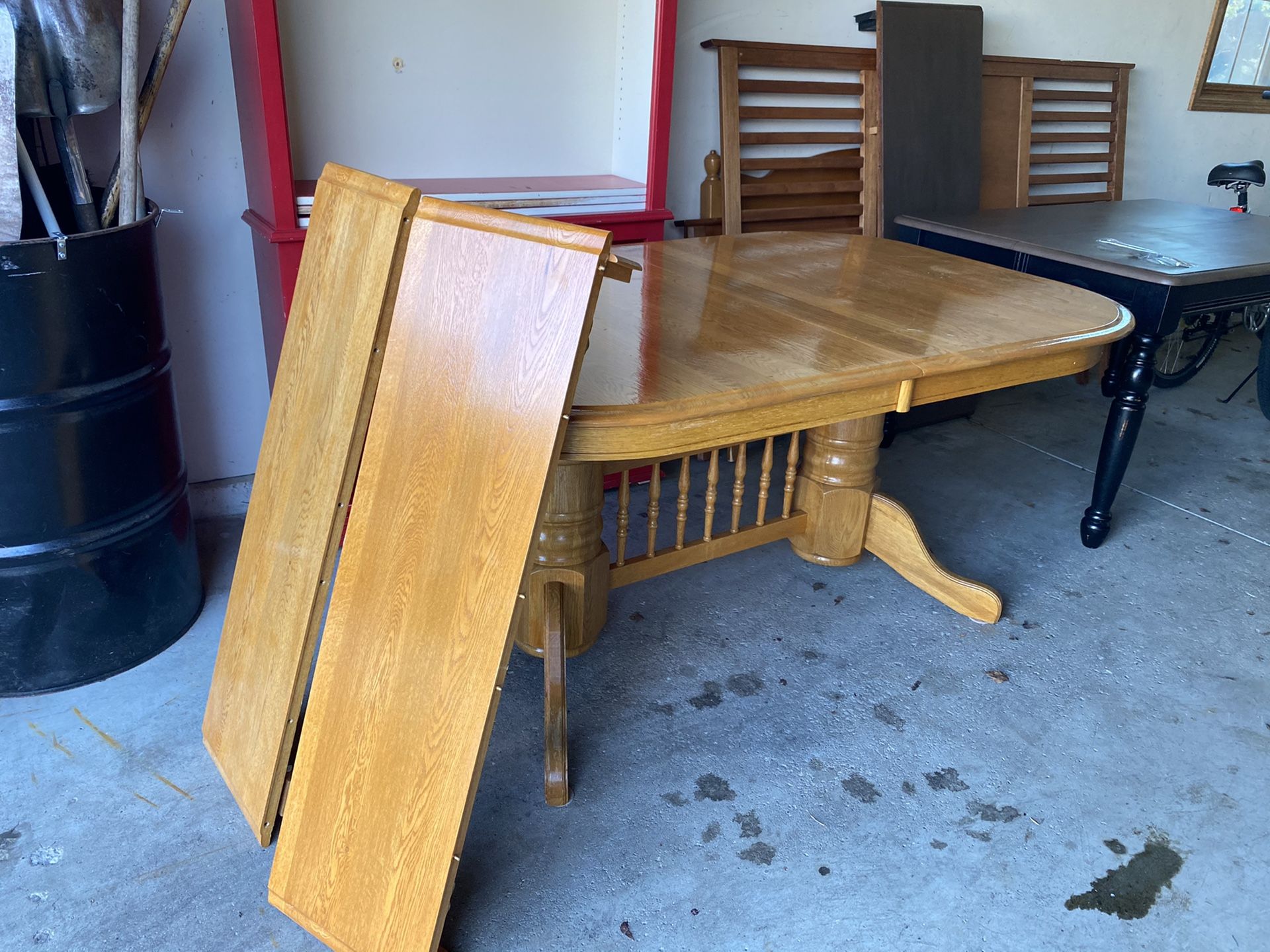 Table honey oak with 2 leaves with 4 chairs . Pick up Dousman or can deliver for $25 more