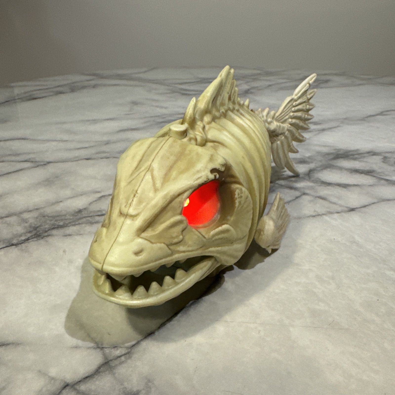 Halloween Piranha Fish Skeleton Animatronic Red Lights Movement Sound Decor Bone 10" long x 3" wide x 5" tall Activated by top button that starts the