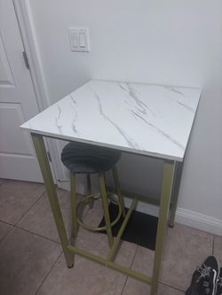 High top grey/white marble table with gold legs