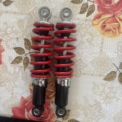 Un Par De Amortiguadores Para Motorcicleta  Atvs
