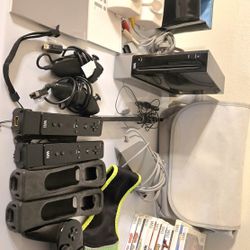 Used wii console with games, games show wear from use. 