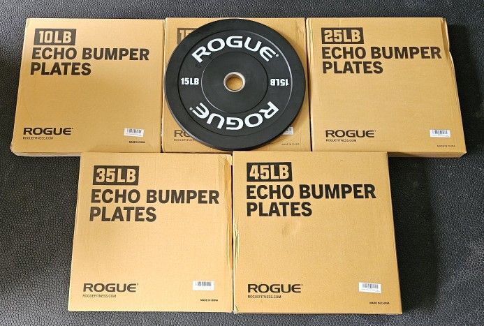 READ DESCRIPTION Rogue Bumper Plates Weights Dumbbells Squat Rack
Prices are below.
New Rogue Bumper (10/15/25/35/45 lb pairs) - $520
New Rogue Bum