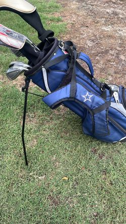 Dallas cowboys golf bag with some clubs