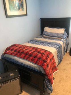 Twin bed with headboard and footboard.