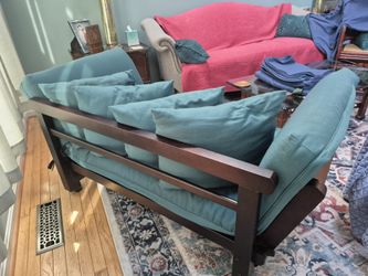 2 sofas with complete green and blue covers for each