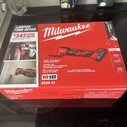 Milwaukee Multi Tool with Tool, Charger, Battery,  and Accessories