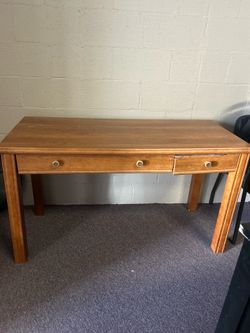 honey-brown wooden desk