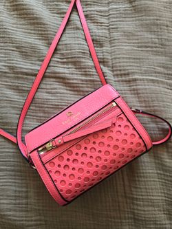 Kate Spade Perri Lane Bubbles Looloo Crossbody bag in a vibrant pink perforated leather.