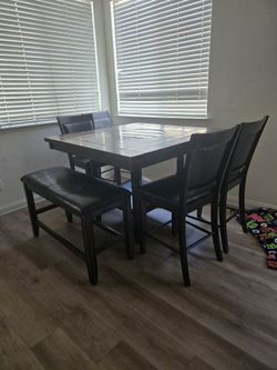 Dining table with chairs and bench