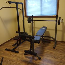 Weight bench and pull down machine.