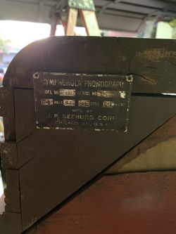 Antique, coin operated stand up phonograph player