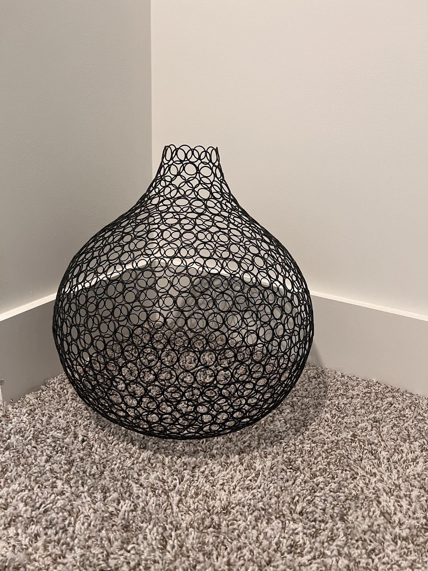 Black metal wire accent piece.