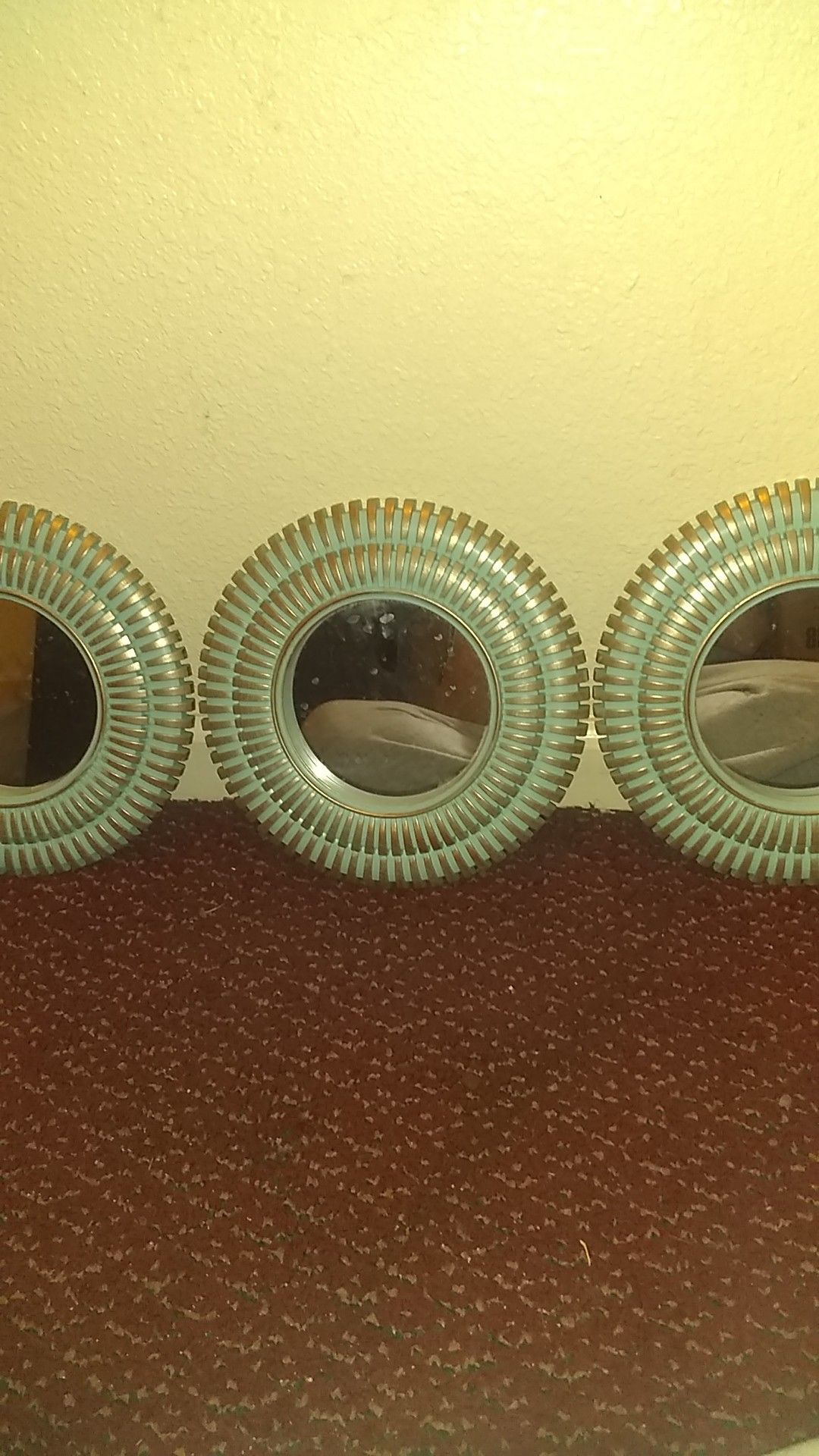 3 small wall mirrors.