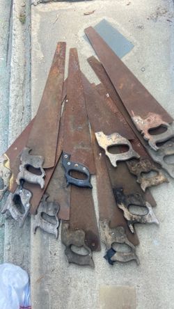 Bunch of vintage wood hand saws.