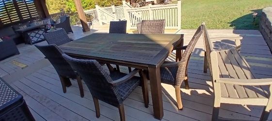 Rectangular outdoor wood table with six chairs