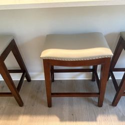 3 Backless saddle-style counter stools 