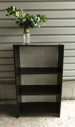 Dark Brown Bookcase With Floral Backing