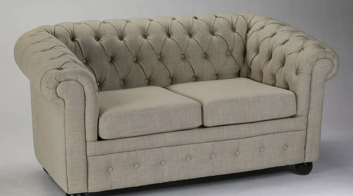 Chesterfield style loveseat in cream linen