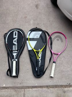 Tennis rackets with cases
