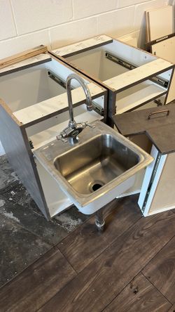 Elkay Stainless steel sink faucet drain and base cabinets