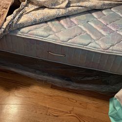 King Size Mattress And Brand New Two Twin Size Box Springs In Plastic Mattress In Good  Shape