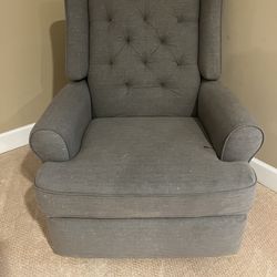 Gray swivel and rocking chair