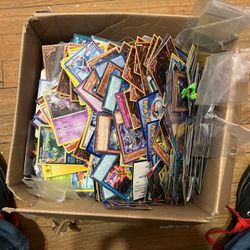 Box Of Pokenmon And Yugo Cards
