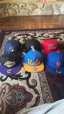 Assorted MLB and NBA hats