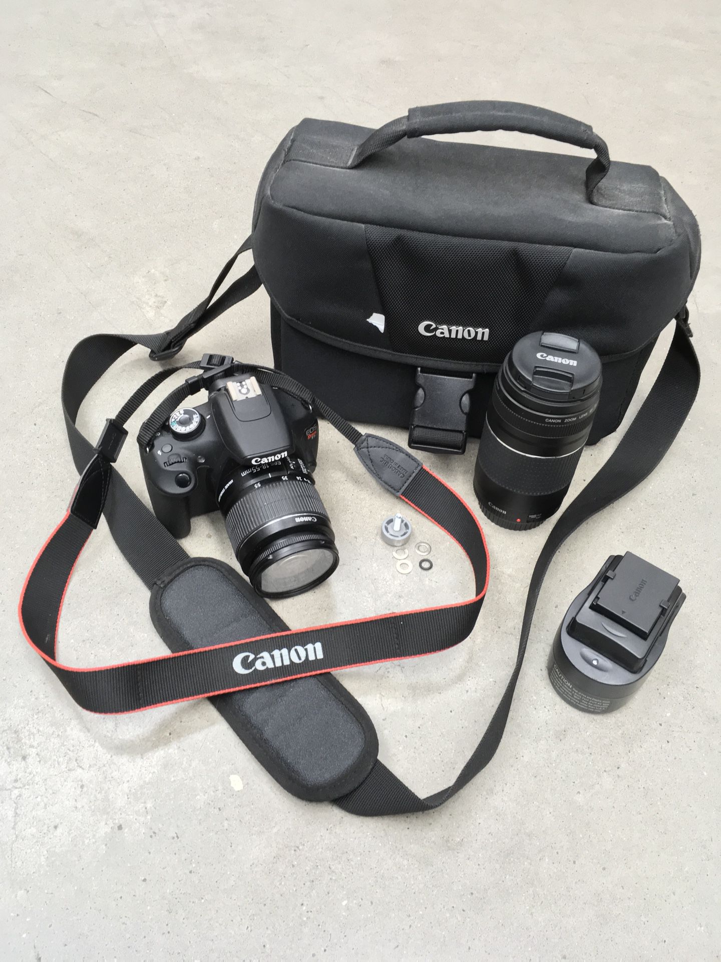 Canon EOS Rebel T5 - 18MP ( Comes W/ Carrier Bag, Two Lenses , And Charger )