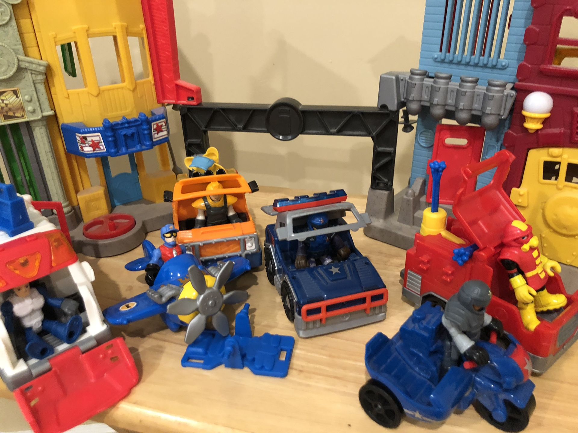 Imaginext city lot include the city, police cars, police motorcycle, ambulance, tow truck, and fire truck, airplane
