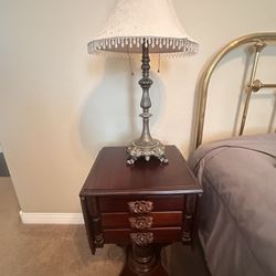 Antique mahogany drop-leaf end table with three drawers