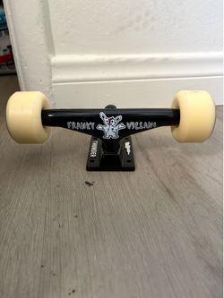 Skateboard trucks with wheels bearings and bushings
