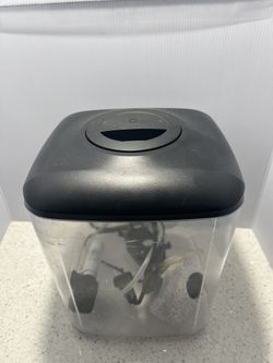 Aqueon Mini Cube LED Desktop Aquarium Kit, which has a capacity of 1.6 gallons