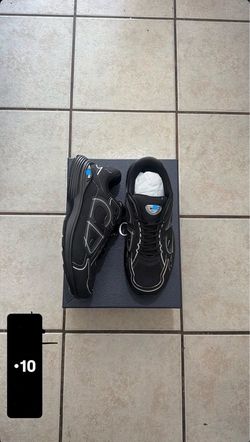 Black Low-Top Sneakers with Blue Detail