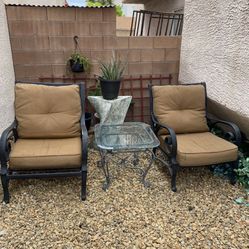 Two Chairs And One Coffee Table Outside Doors