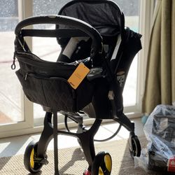 NEW Doona Car Seat + Stoller + Bag