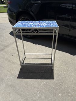 Metal Tile Top Side Table.  27”h x 20”w x 12” d. Small corner tile missing as shown. Overall good condition 