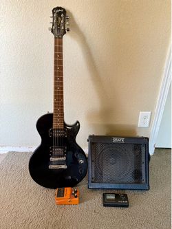 Epiphone guitar and crate amp combo.