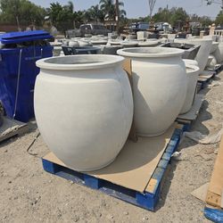 CONCRETE PLANTERS $450 EACH. (33" TALL X 30" WIDE) LIGHT WEIGHT CEMENT PLANTER POTS