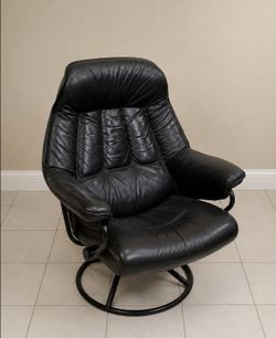 Black leather reclining, spinning chair