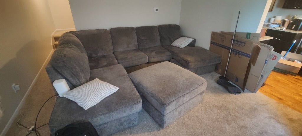 Grey Couch And Reversible Ottoman