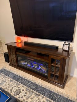 Tv stand with heated fireplace with led lights