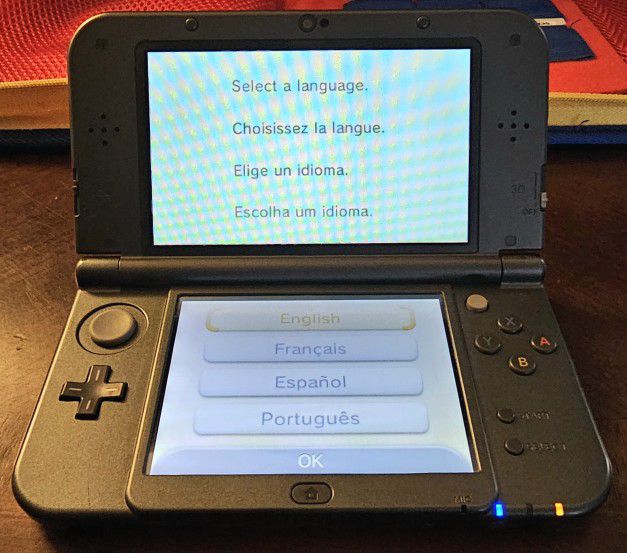 The "NEW" Nintendo 3ds XL Gray Consule System w/ Charger Plus 23 Games Bundled Super Package!!